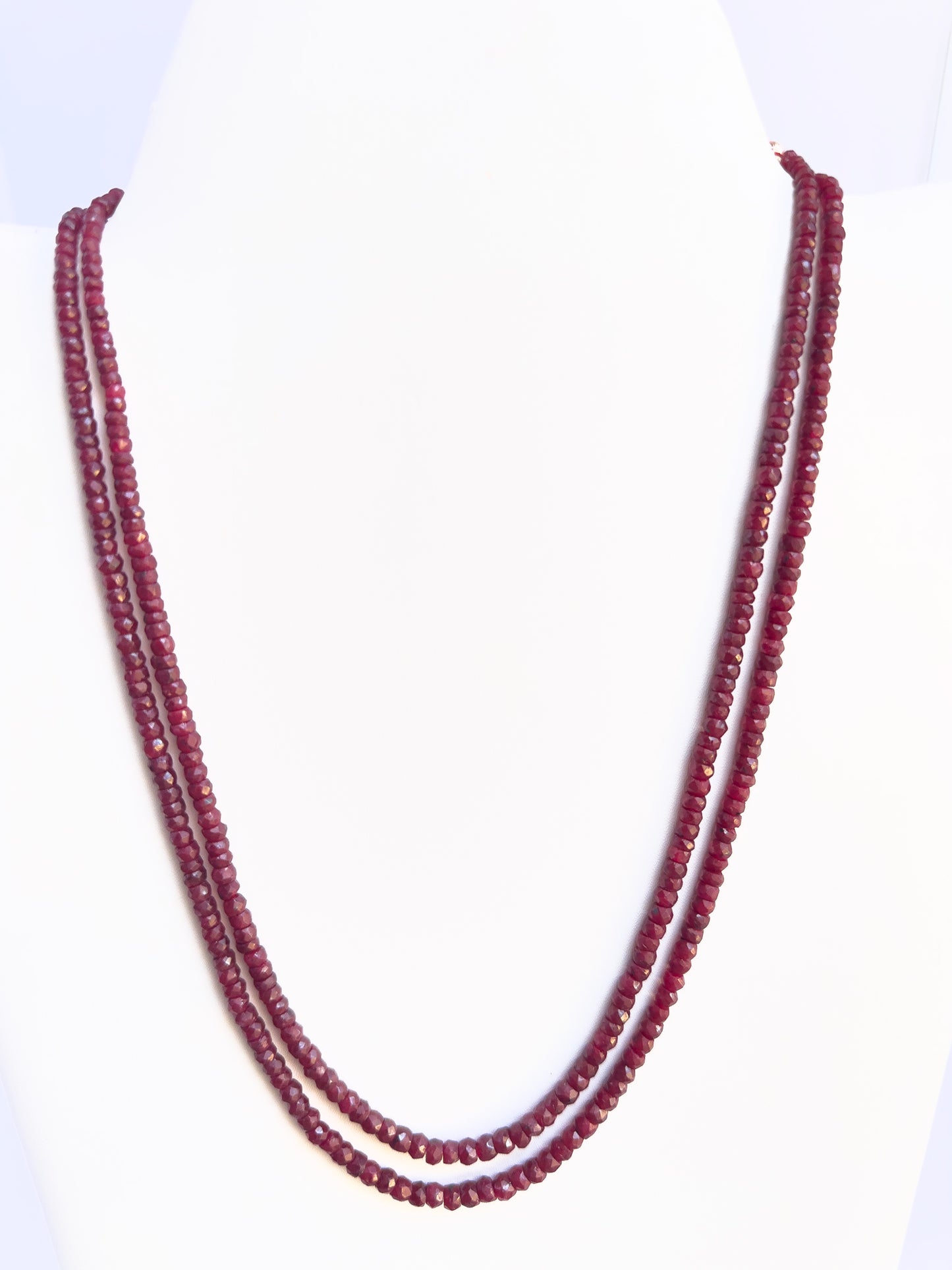 Dyed Ruby necklace with faceted rondelle beads, 4–4.7mm size, glowing red gemstone strands.