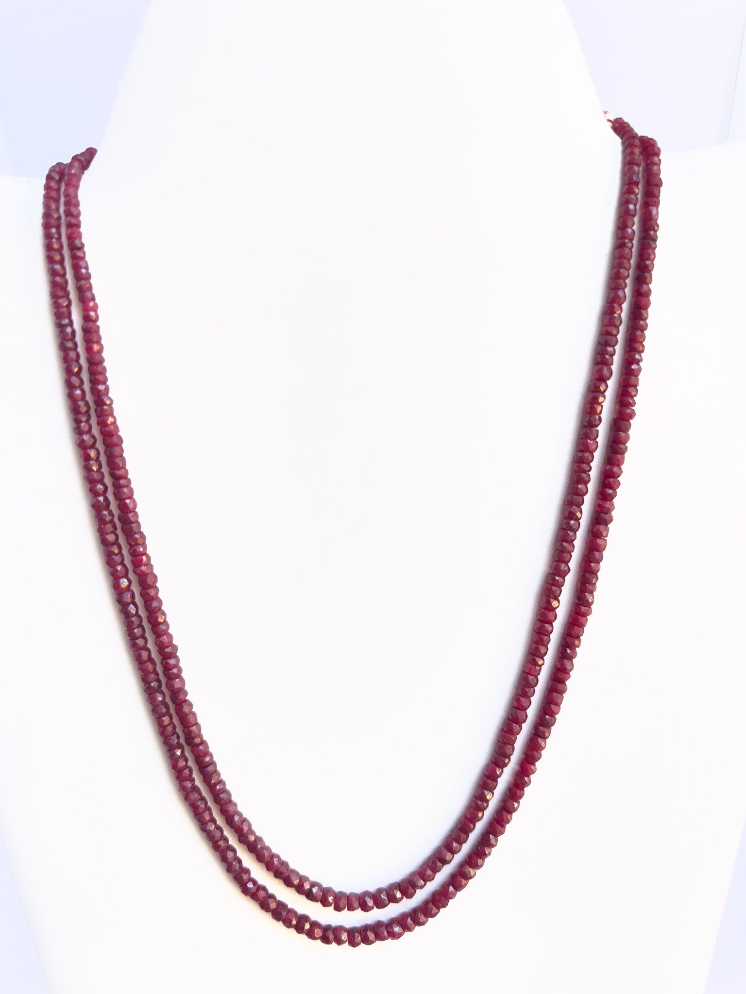 Dyed Ruby necklace with faceted rondelle beads, 4–4.7mm size, glowing red gemstone strands.