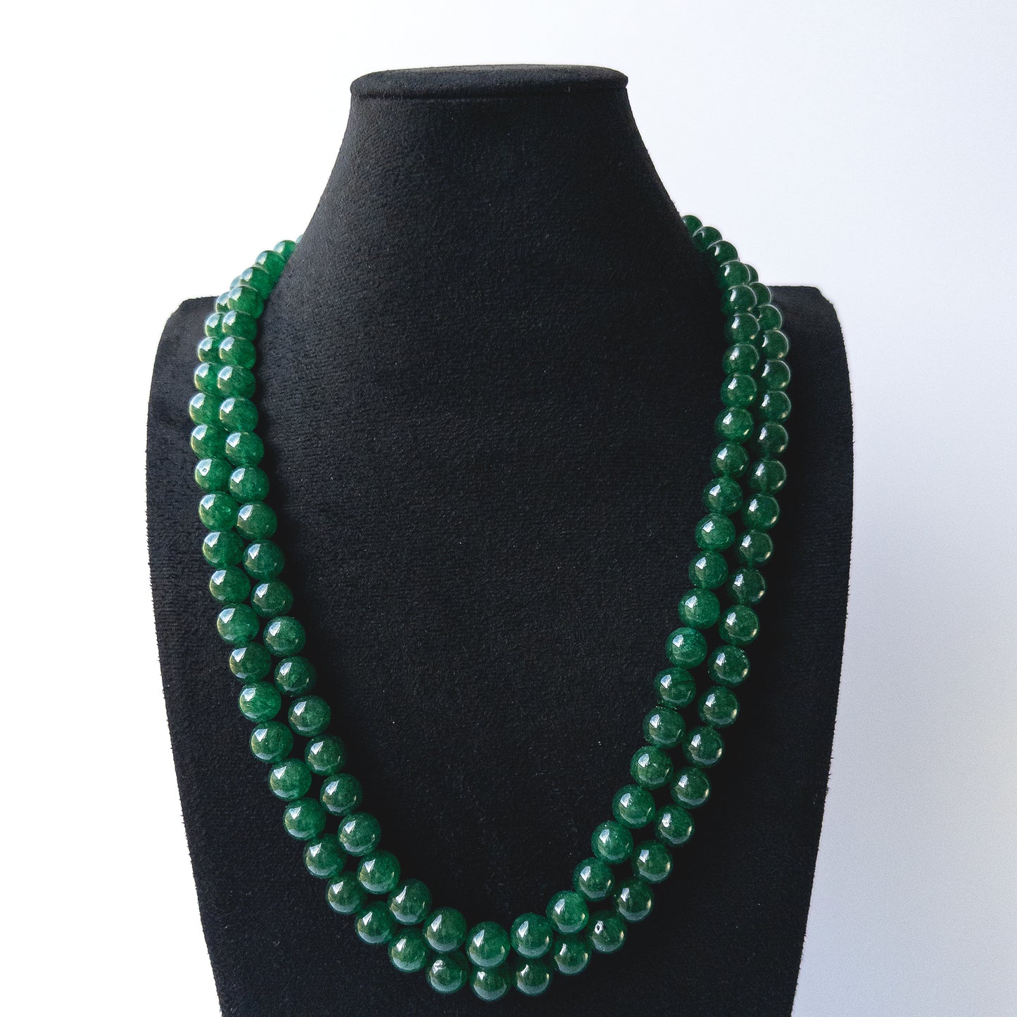 Authentic Emerald stone beads showcasing deep green tones and smooth round finish for jewellery designers.