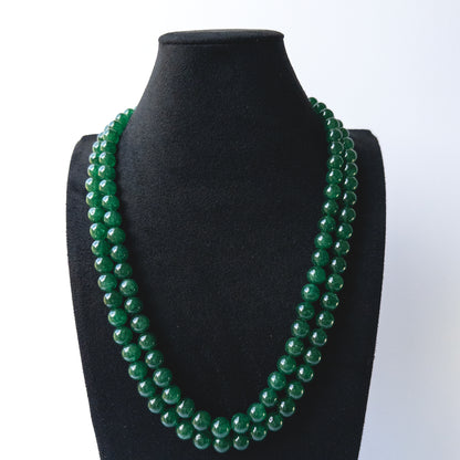 Authentic Emerald stone beads showcasing deep green tones and smooth round finish for jewellery designers.