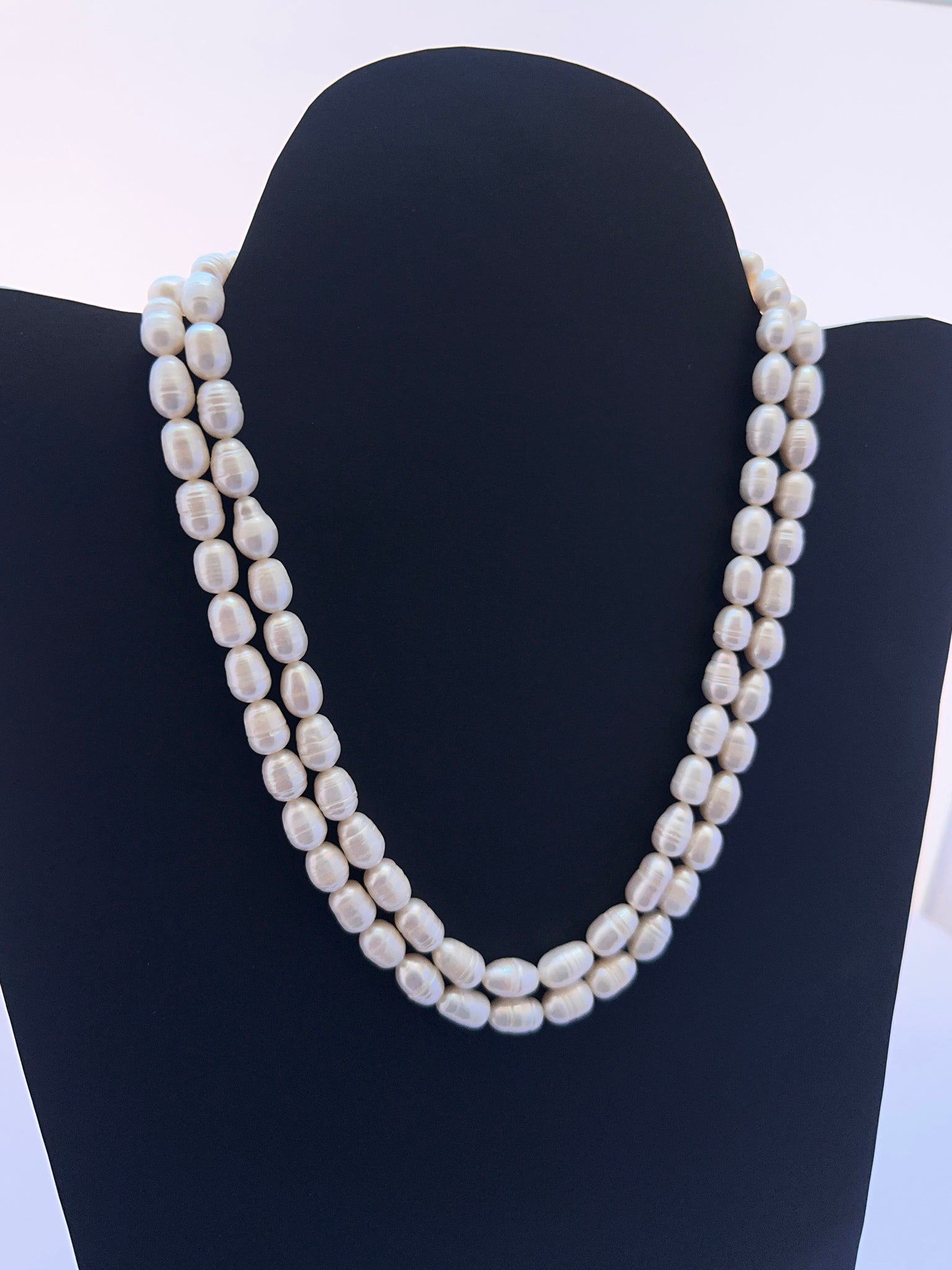 Freshwater pearl necklace featuring oval textured pearls with soft white lustre and smooth finish.