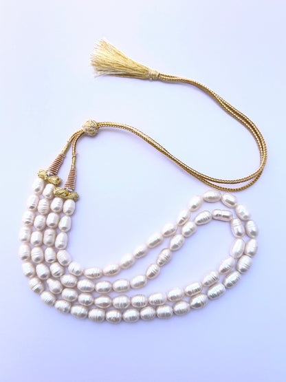 Natural freshwater pearl necklace with oval textured pearls arranged in a graceful two‑strand style.