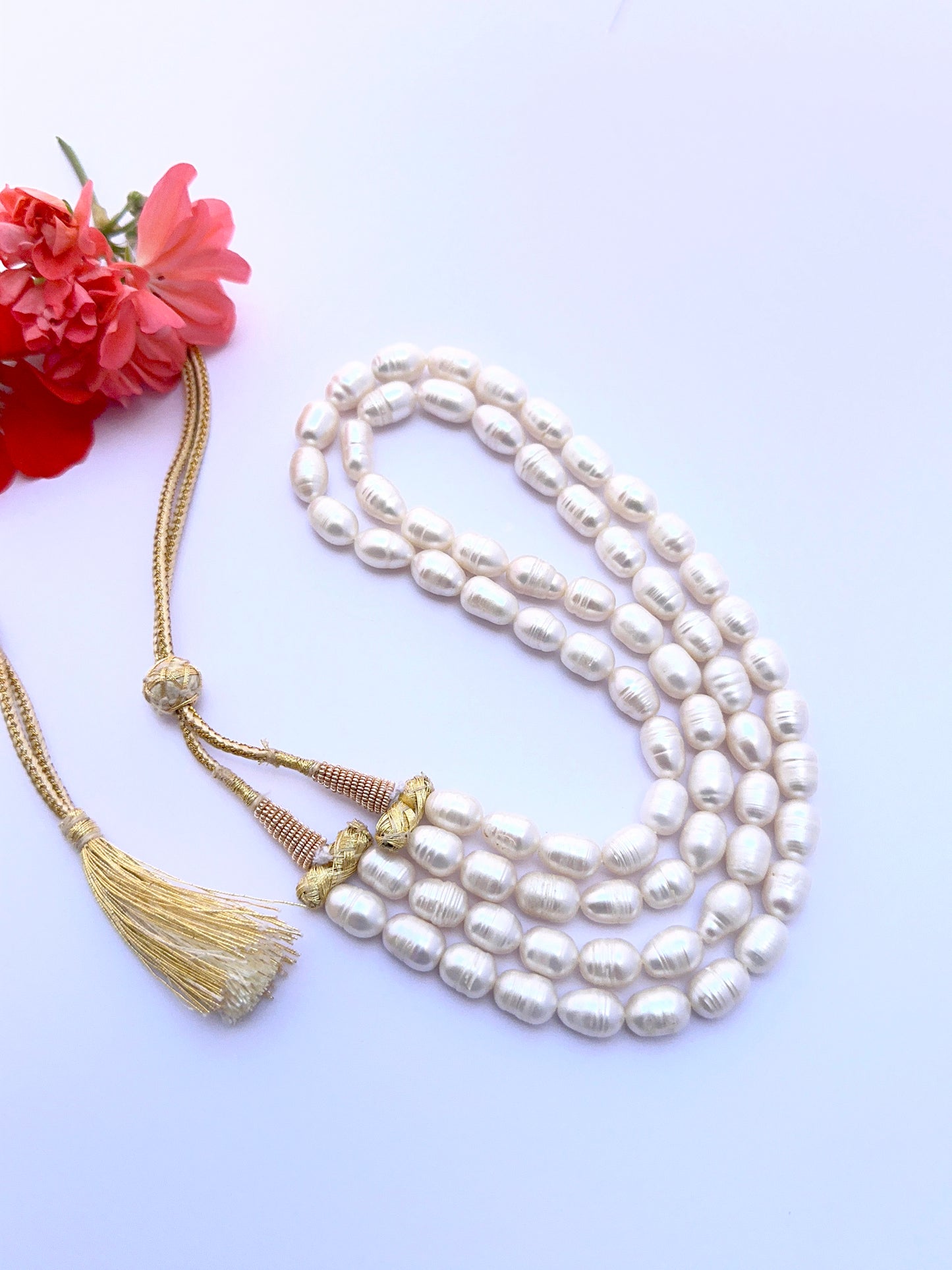 Natural freshwater pearl necklace with oval textured pearls arranged in a graceful two‑strand style.