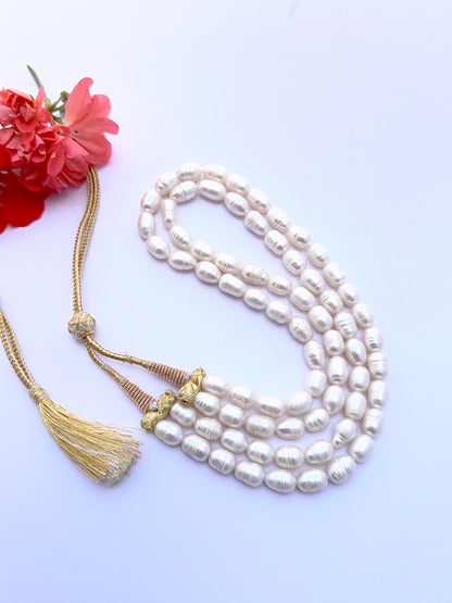 Natural freshwater pearl necklace with oval textured pearls arranged in a graceful two‑strand style.