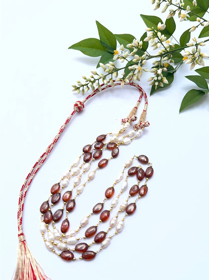 Hessonite and pearl necklace with smooth oval beads showing golden‑brown hues and soft lustre.