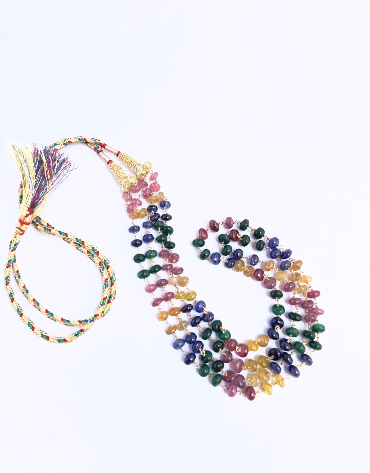 Elegant multi precious necklace, smooth rondelle beads, 254 carats of brilliance with silk tassel accent.