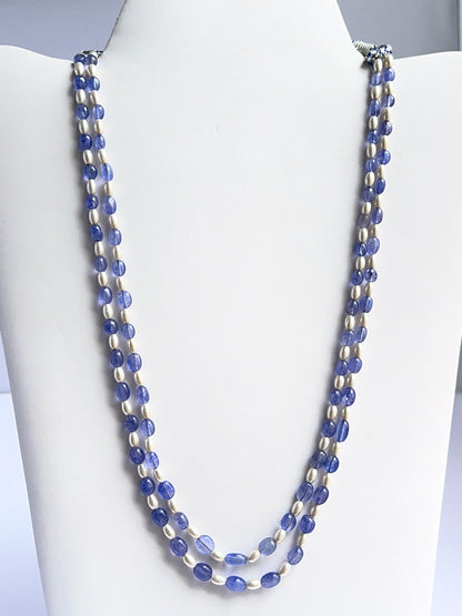 Two‑strand quartz and shell pearl necklace featuring smooth oval beads in soft neutral tones.