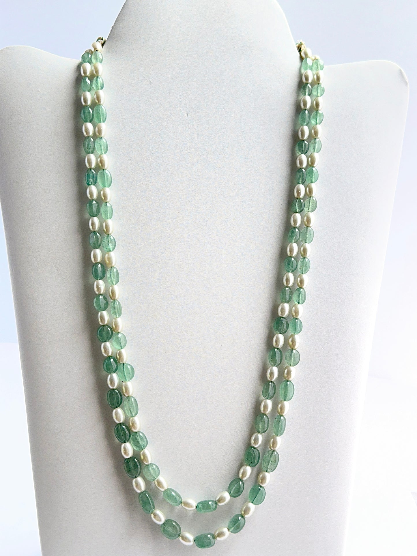 Two‑strand quartz and shell pearl necklace featuring smooth oval beads in a polished design.