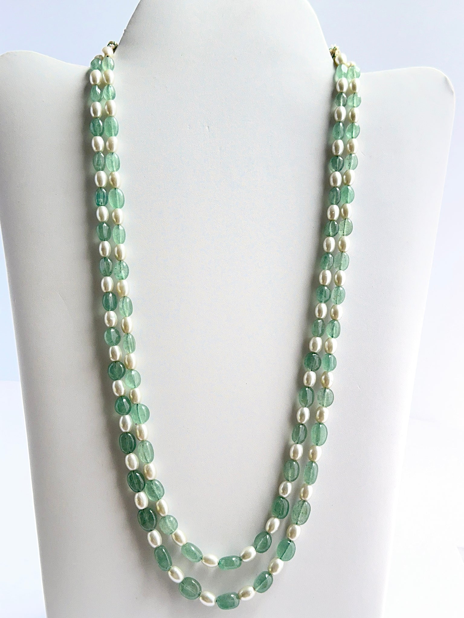 Two‑strand quartz and shell pearl necklace featuring smooth oval beads in a polished design.