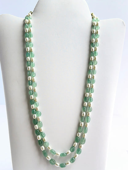 Two‑strand quartz and shell pearl necklace featuring smooth oval beads in a polished design.