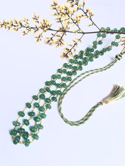 Quartz gemstone beads necklace, melon cut, radiant shine, silk tassel detail.