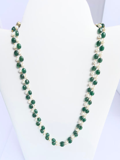 Close-up of quartz beads paired with luminous shell pearls, polished finish, arranged in strands.