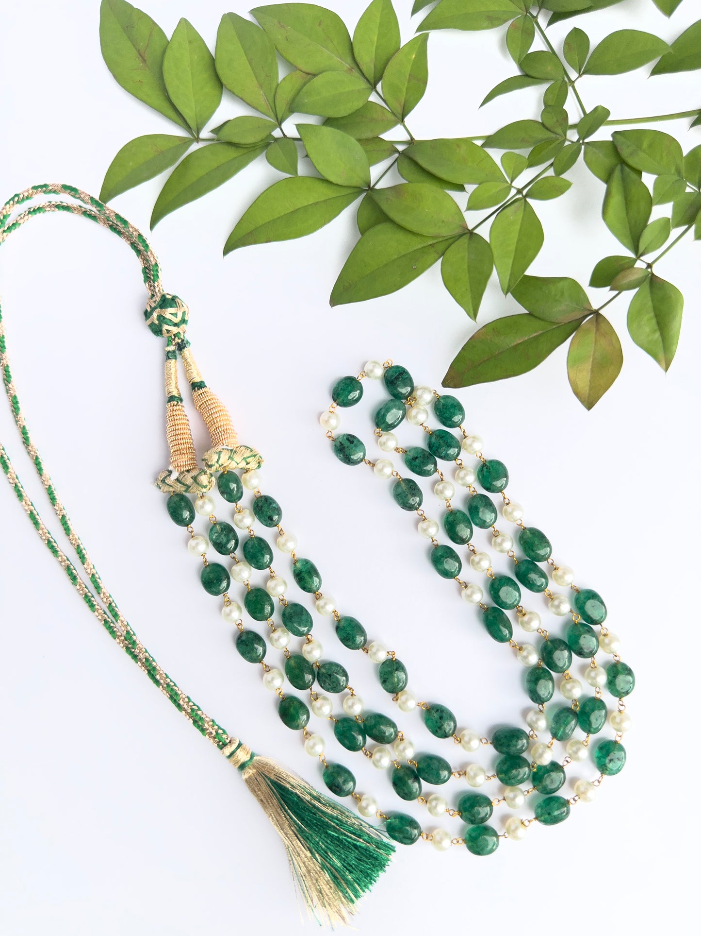 Necklace showcasing natural quartz and shell pearls, smooth cut, timeless styling.