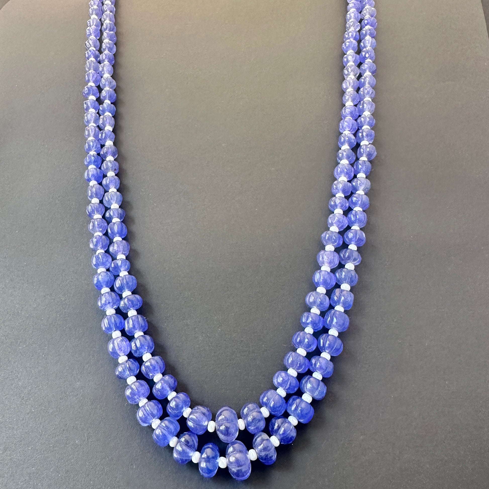 Two-strand quartz necklace with adjustable silk tassel, crafted from polished natural gemstone beads.