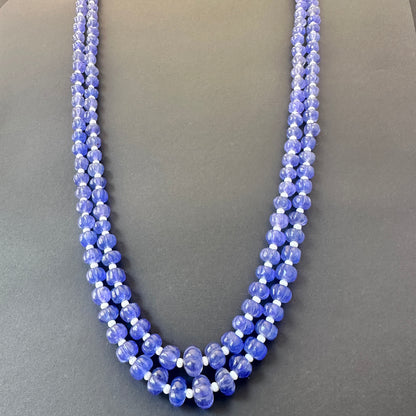 Two-strand quartz necklace with adjustable silk tassel, crafted from polished natural gemstone beads.