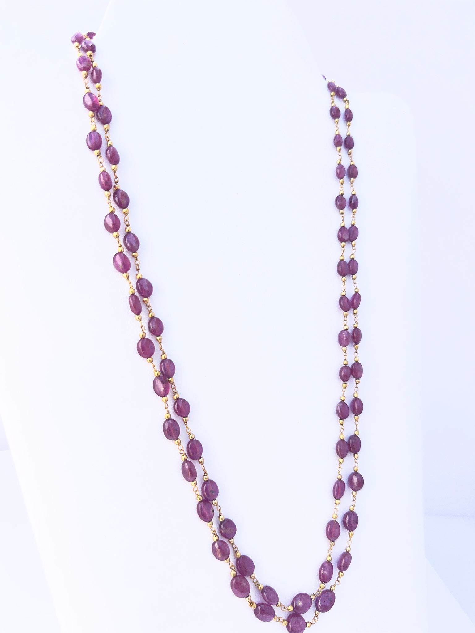 Ruby stone beads necklace, deep dyed colour, smooth oval design, 52–54cm strand length.