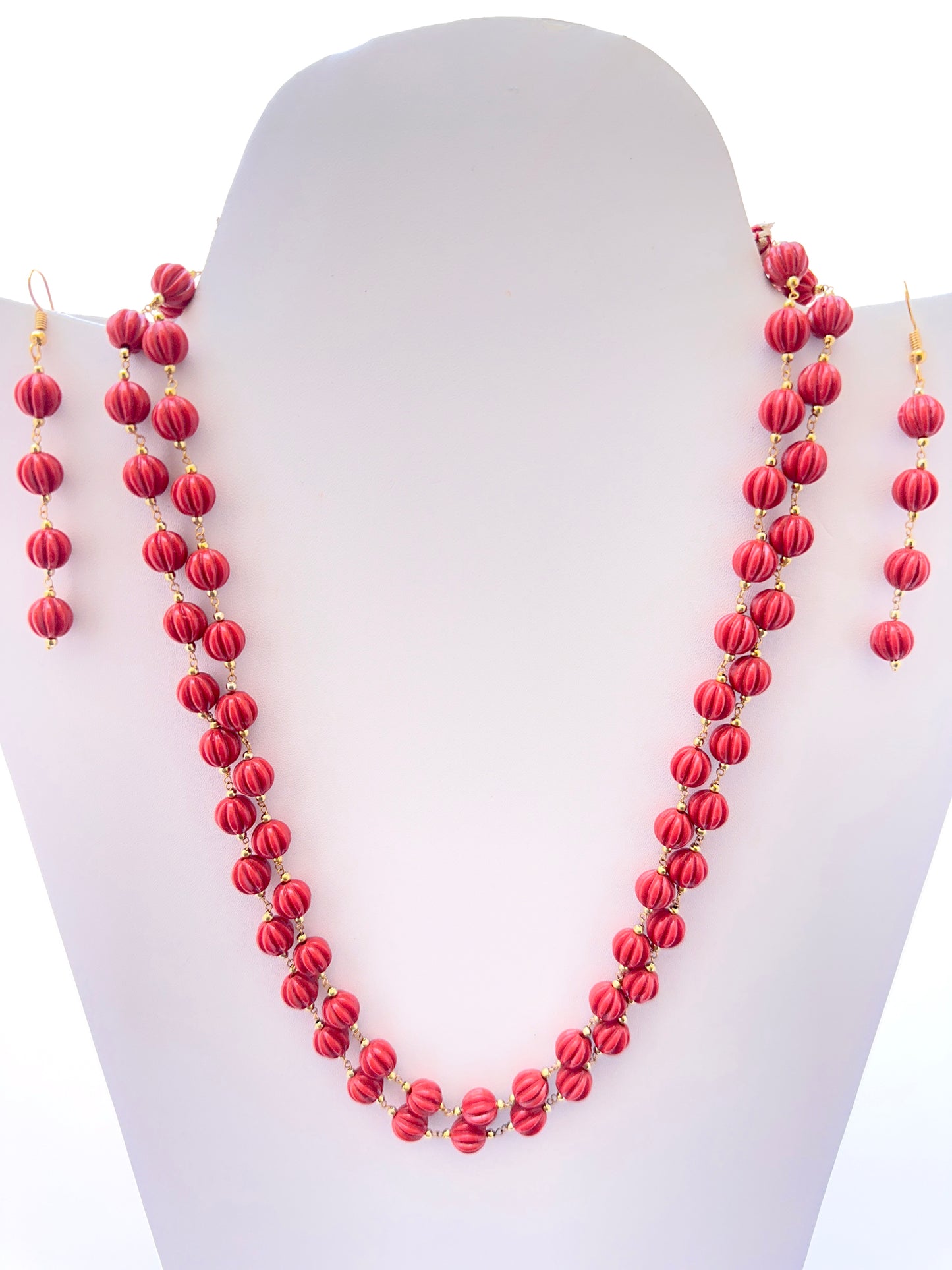 Elegant coral necklace featuring pumpkin‑shaped beads and matching earrings option
