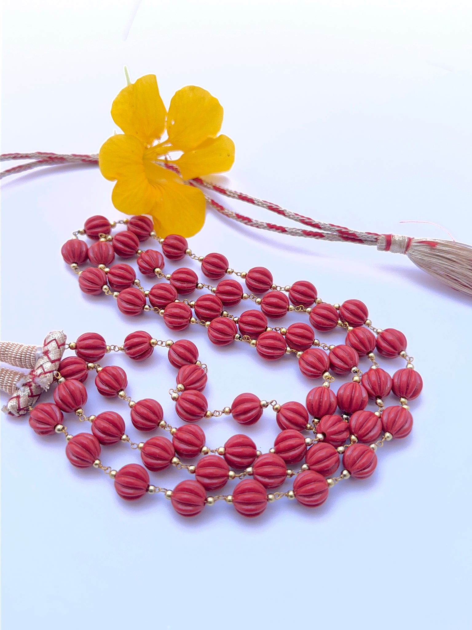 Taiwan coral necklace with carved beads showing bold colour and unique texture.