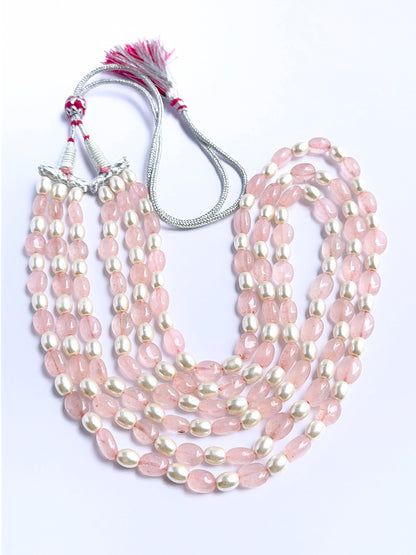 Elegant multi‑strand gemstone necklace featuring quartz and shell pearls