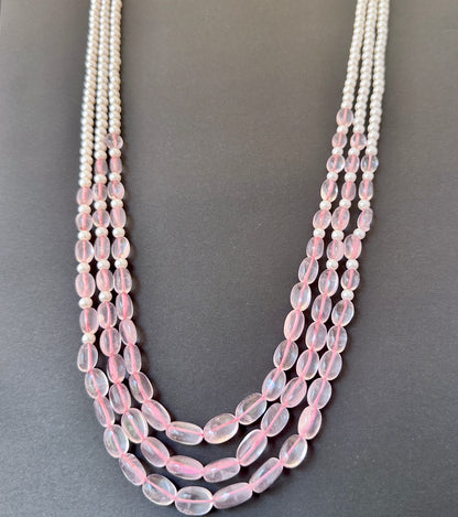 Natural gemstone beads with smooth finish and subtle sparkle in a multi-strand design.