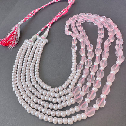 Soft pink stone beads paired with luminous shell pearls in a 58cm adjustable necklace.