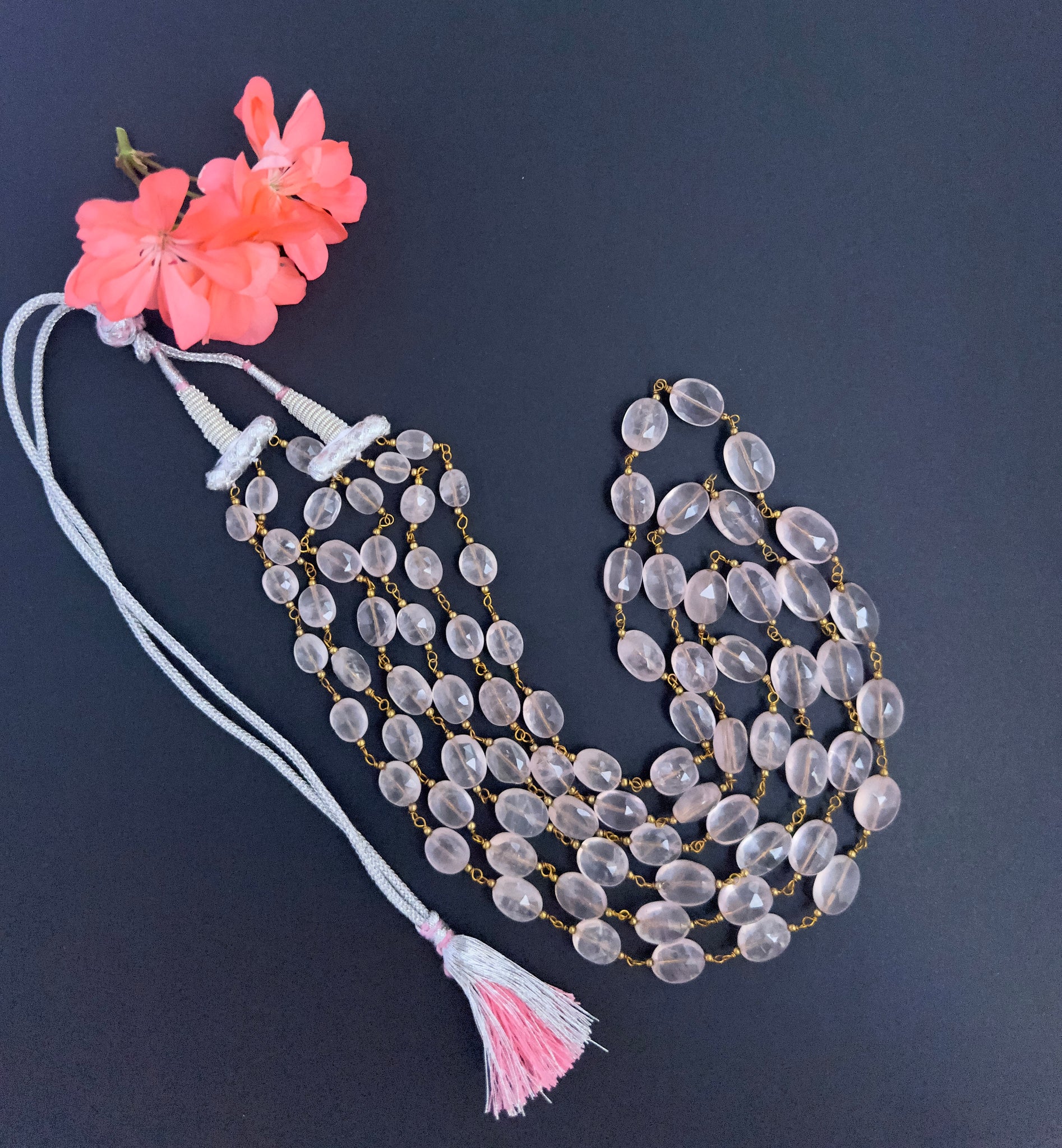 Strawberry Quartz gemstone beads necklace, polished faceted oval cut, radiant shine, silk tassel detail.