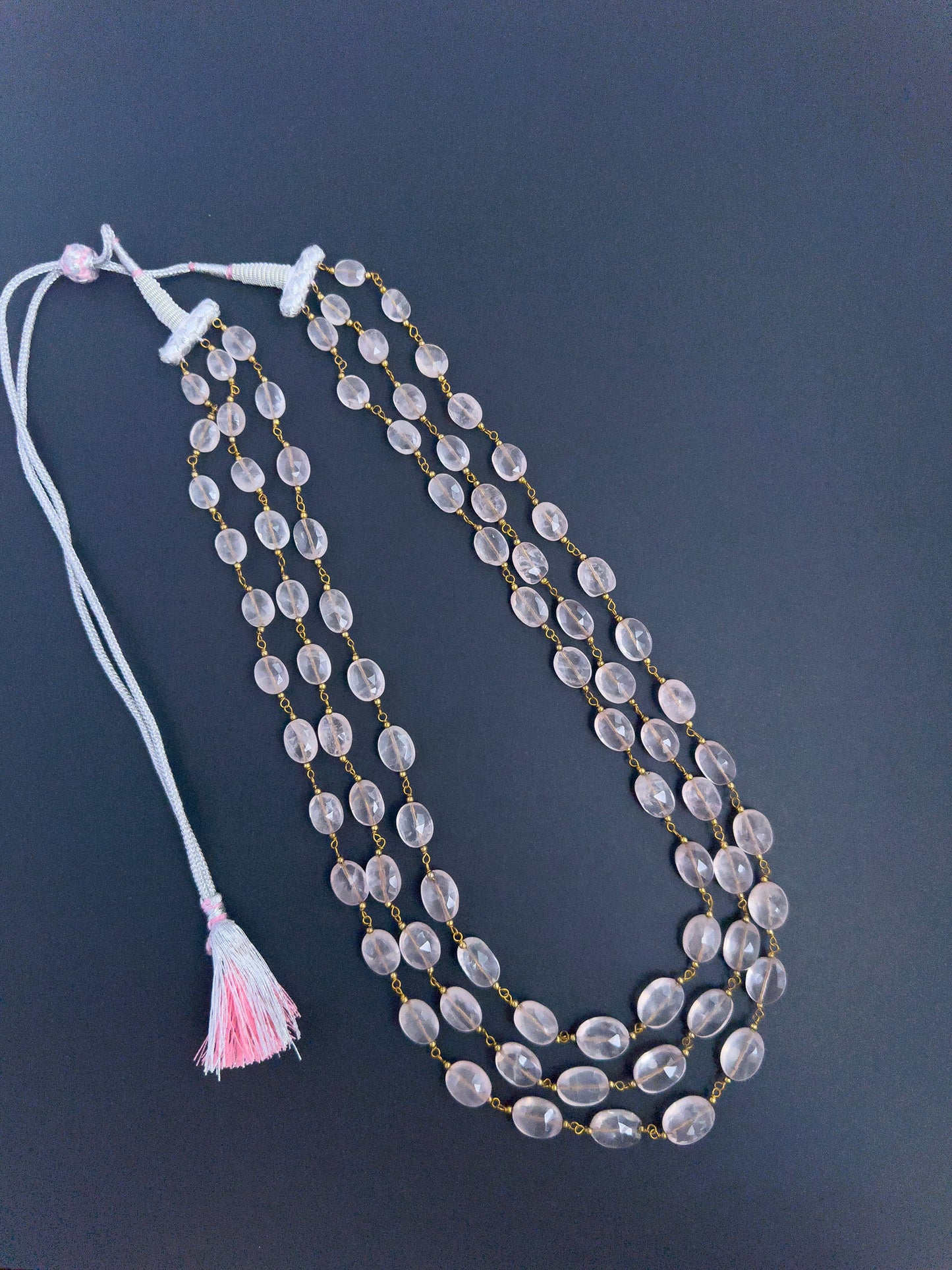 Elegant Strawberry Quartz necklace, three strands of faceted oval beads, 468 carats of brilliance.
