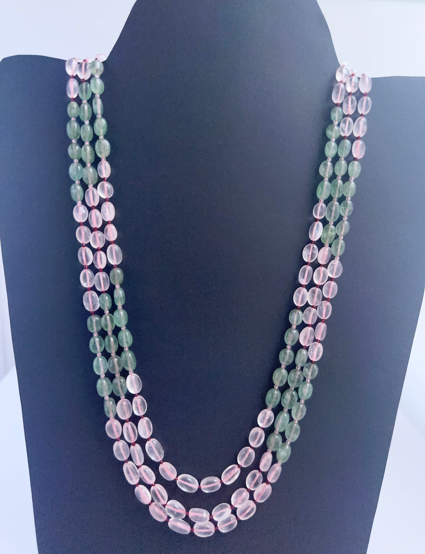 Quartz necklace with smooth oval beads, three strands, 6–7.7mm size, radiant clarity.