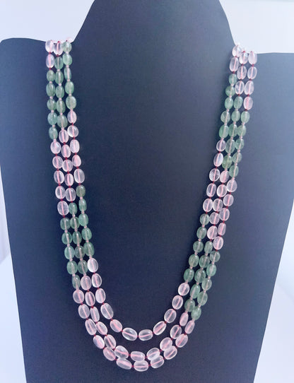 Quartz necklace with smooth oval beads, three strands, 6–7.7mm size, radiant clarity.