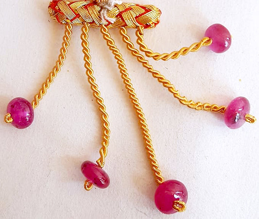 Ruby rondelle beads arranged in a neat 5-piece layout with vibrant shine and consistent sizing.