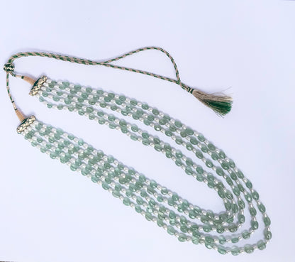 Quartz and shell pearl necklace, 568 carats of brilliance, finished with silk tassel accent.