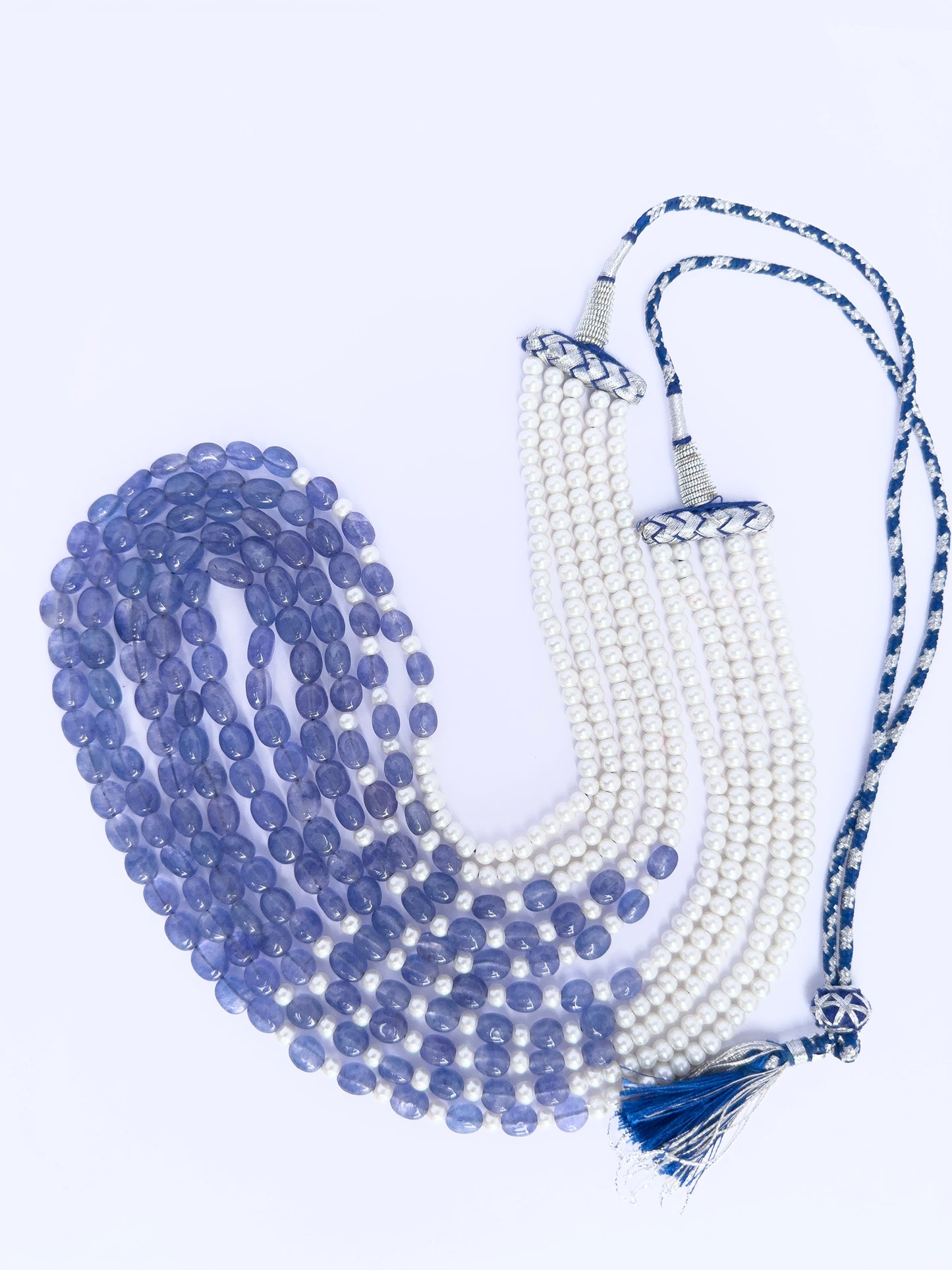 Quartz and shell pearl necklace, 541 carats of brilliance, finished with silk tassel accent.