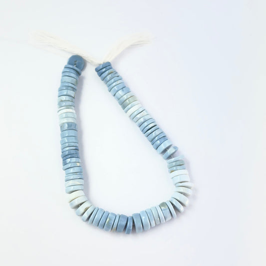 Denim Opal smooth heishi wheel gemstone beads, 7.5mm size, arranged on a 17cm strand for handmade jewellery makers.