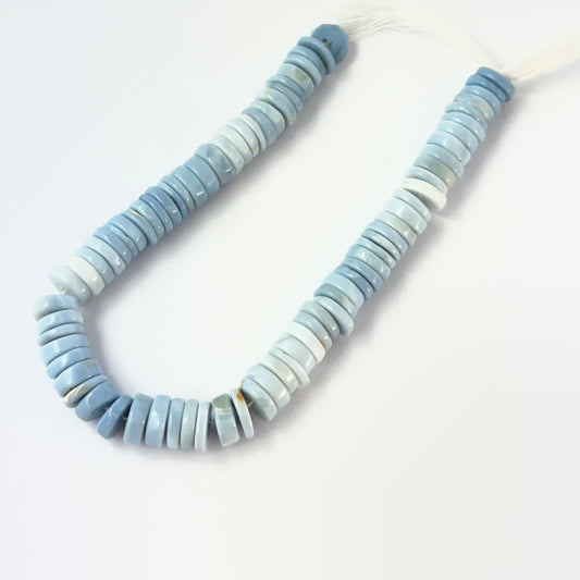 Genuine Denim Opal stone beads in smooth heishi wheel cut, showcasing soft blue tones for DIY jewellery design.