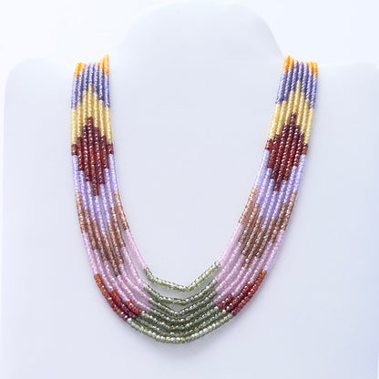 Cubic Zirconia gemstone beads necklace, polished rondelle cut, radiant shine, silk tassel detail.