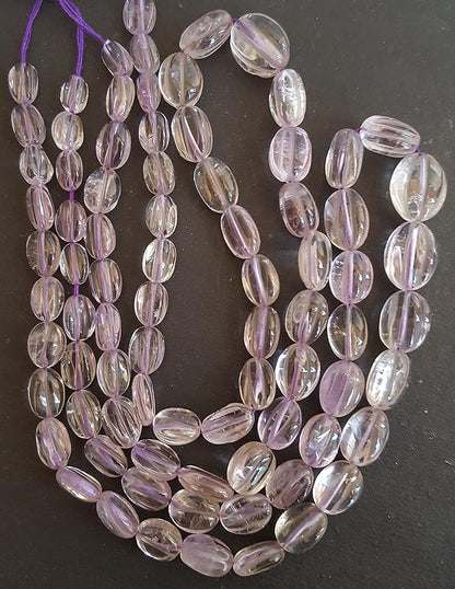 Strand featuring carved smooth amethyst gemstones, ranging from 8mm to 9mm, in a stunning purple hue.