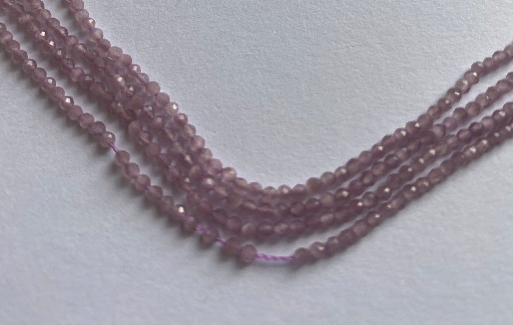 Strand featuring faceted rondelle  amethyst gemstones, ranging from 2mm to 2.2mm, in a stunning purple hue.