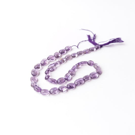 Amethyst smooth oval gemstone beads displaying rich purple hues with a polished finish and elegant rounded shape.