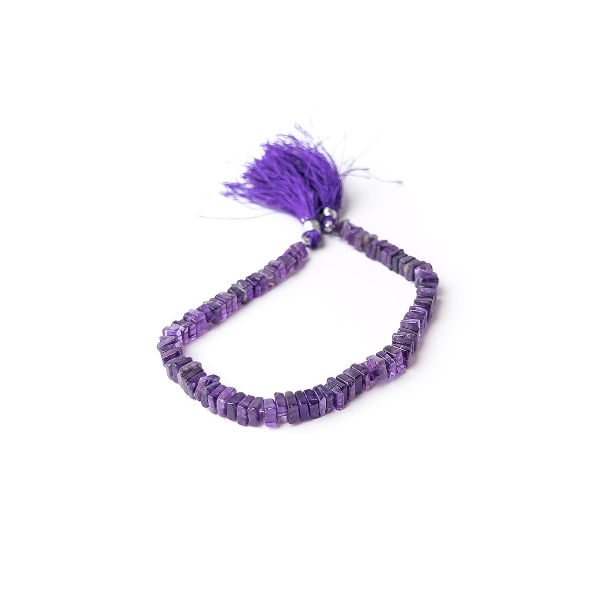 Authentic Amethyst stone beads carefully shaped into smooth square heishi cuts for distinctive jewellery designs.