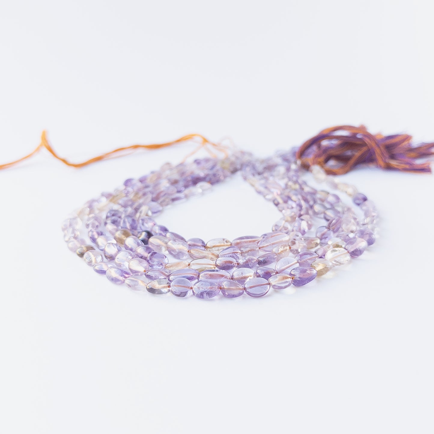 Authentic Ametine gemstone beads showcasing soft colour transitions, smooth tumble shaping and premium bead quality.