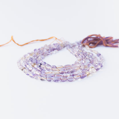 Authentic Ametine gemstone beads showcasing soft colour transitions, smooth tumble shaping and premium bead quality.