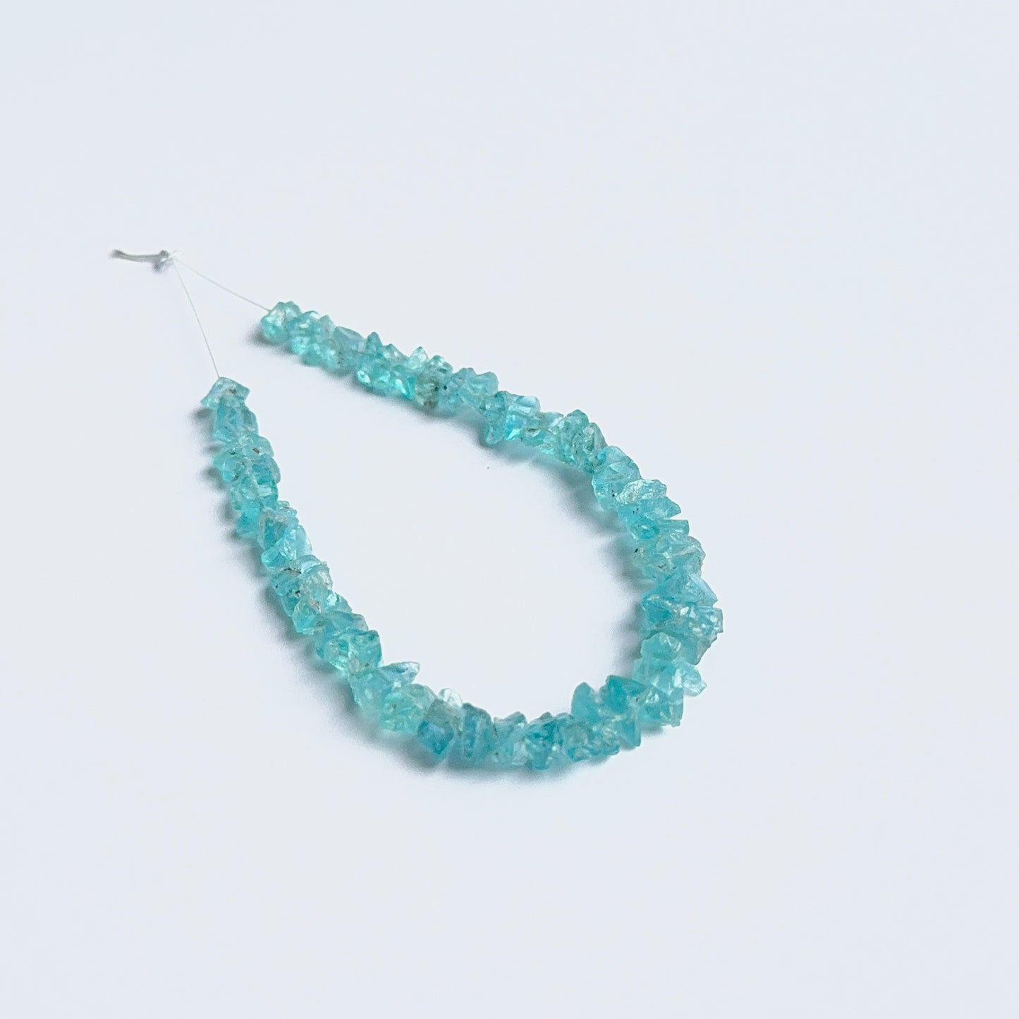 Apatite rough beads arranged neatly to showcase natural gemstone quality and handcrafted appeal.