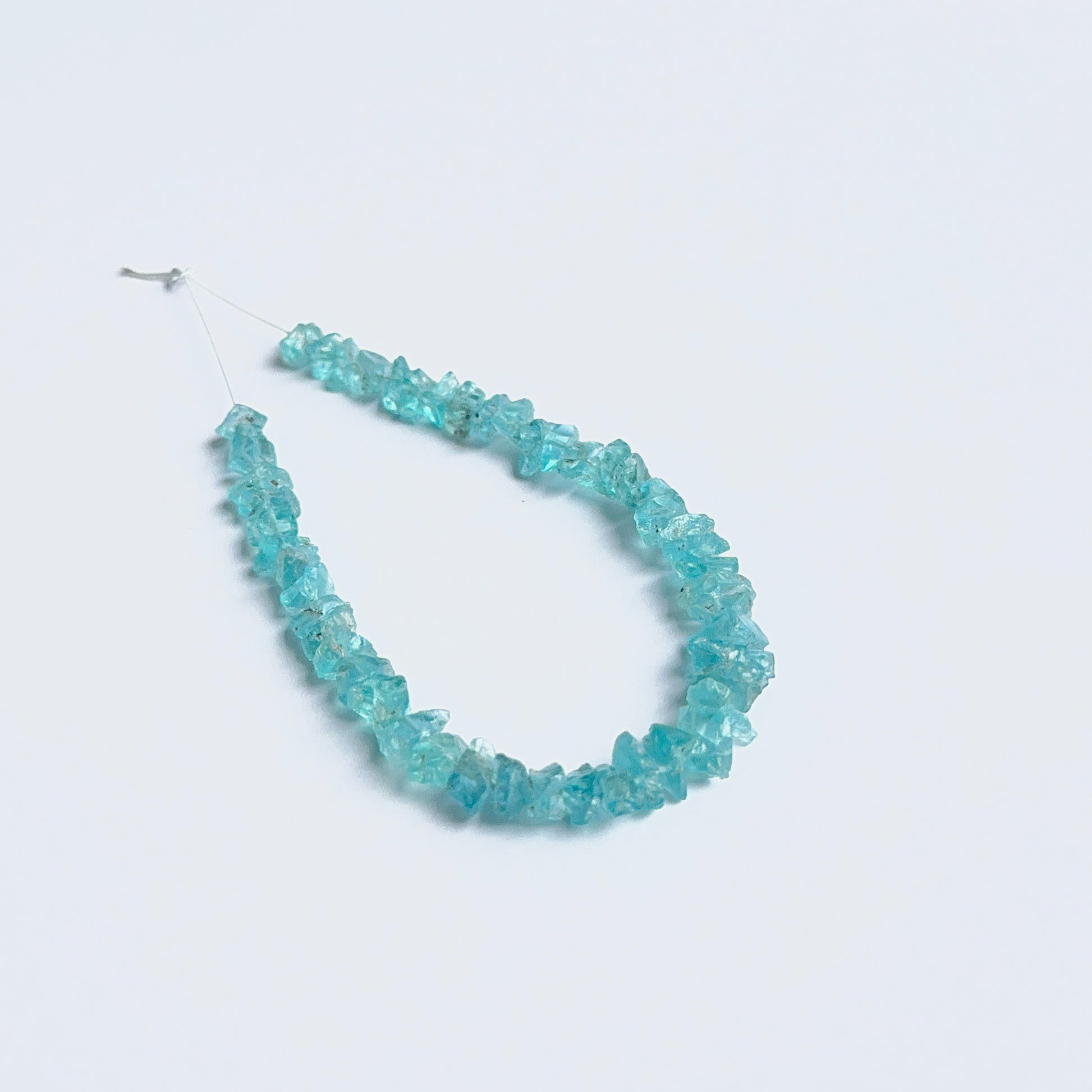 Apatite rough beads arranged neatly to showcase natural gemstone quality and handcrafted appeal.