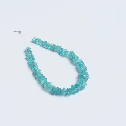 Apatite rough beads arranged neatly to showcase natural gemstone quality and handcrafted appeal.