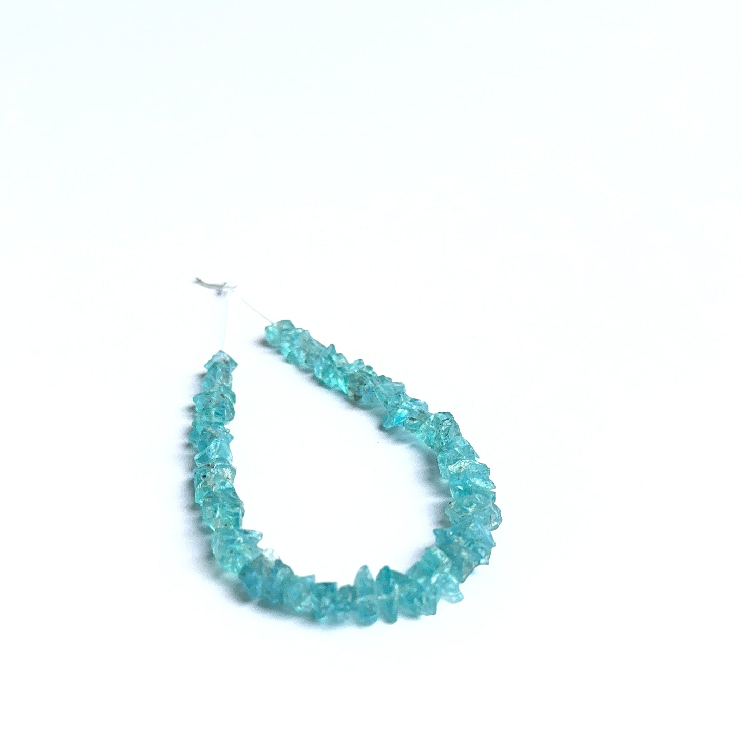 Apatite rough natural gemstone beads showing bright blue tones and raw texture for handmade jewellery.