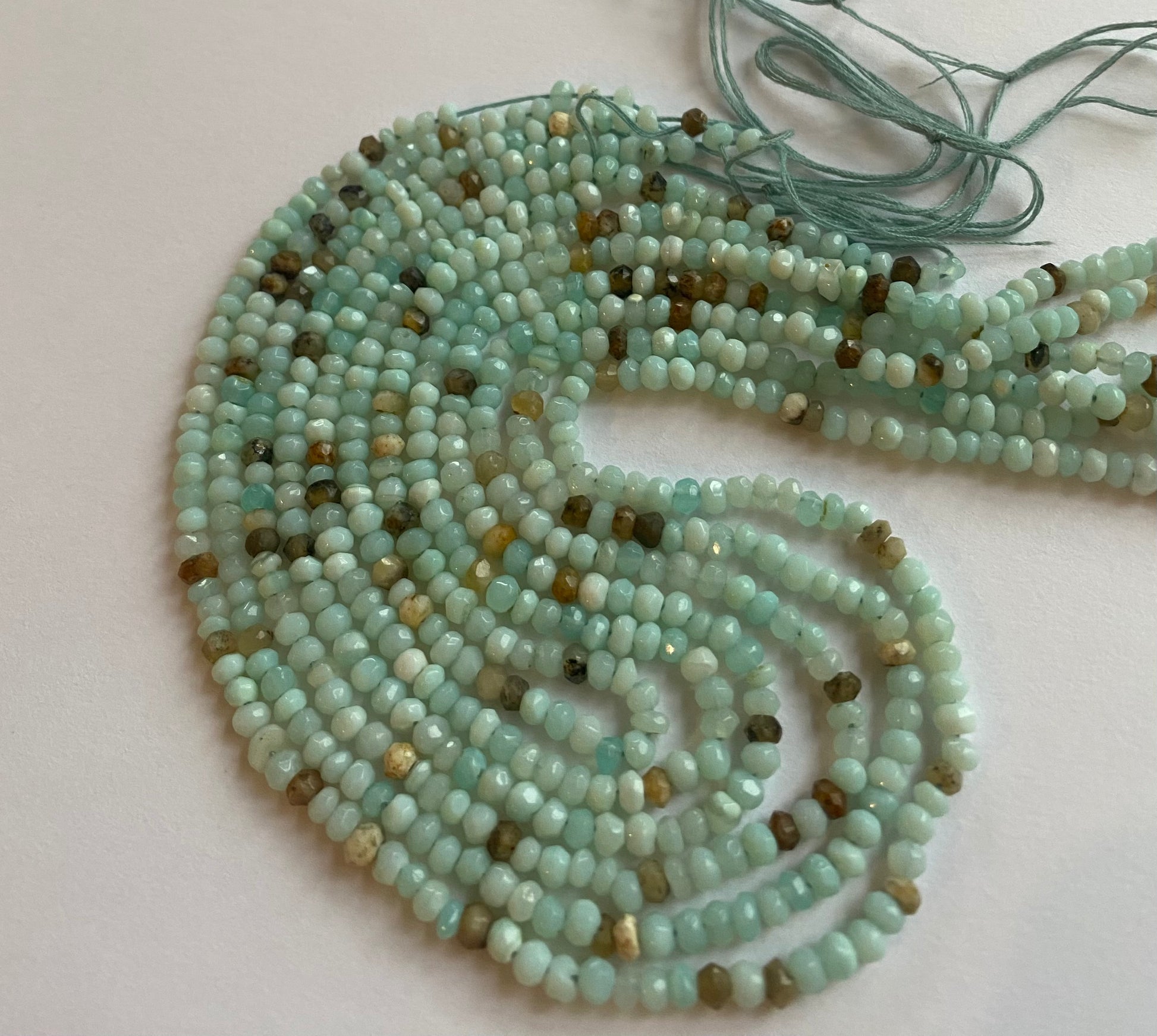  Featuring smooth Australian opal beads, 3-3.5mm in size, showcasing a beautiful aqua hue.