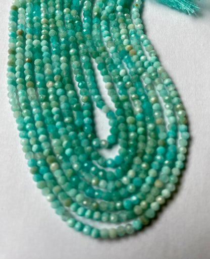  A collection of faceted Aquamarine beads, showcasing their stunning Aqua green brilliance.  