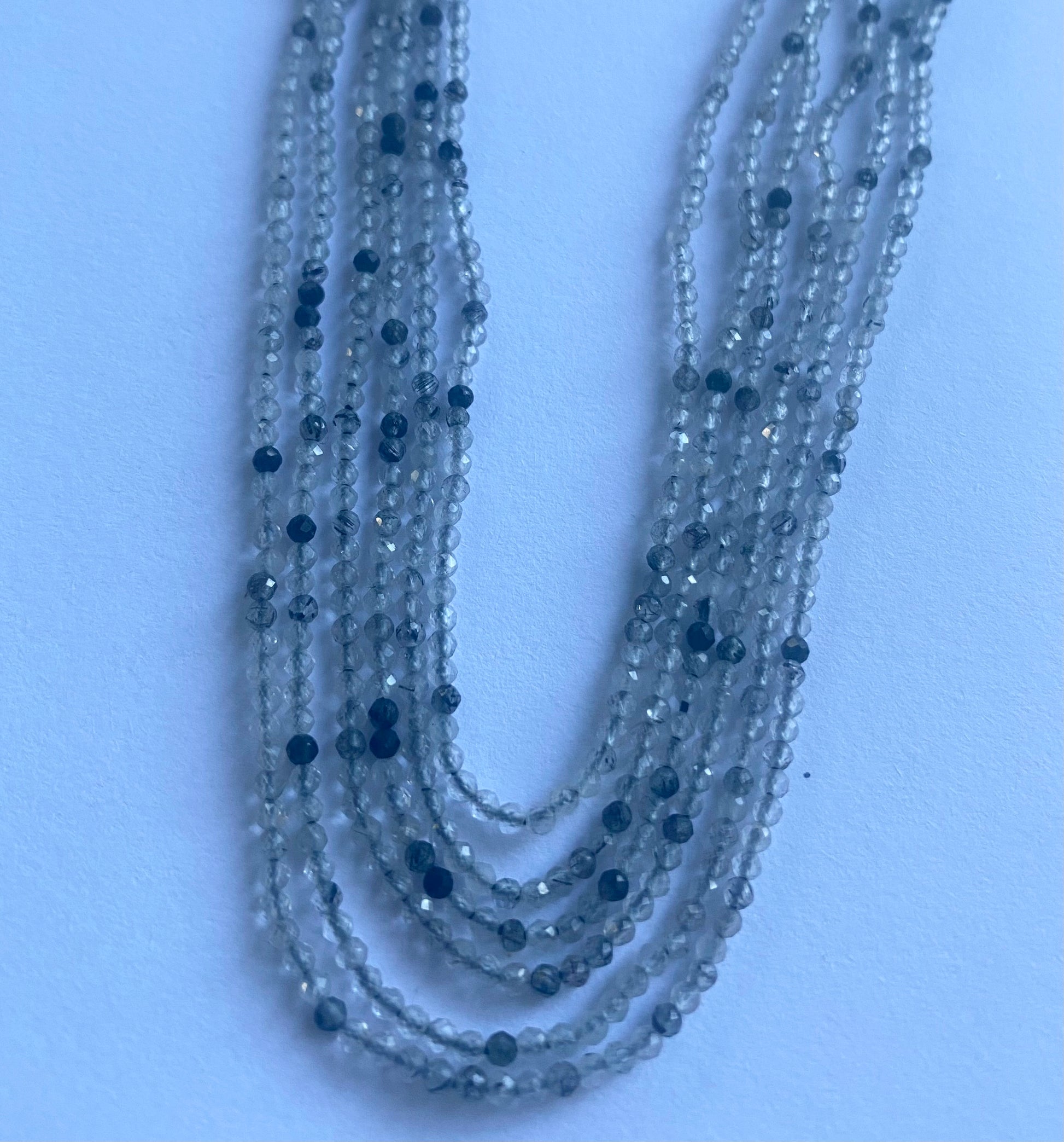 Elegant strand adorned with 2mm Black Rutile  micro faceted rondelle beads, perfect for adding a pop of colour.