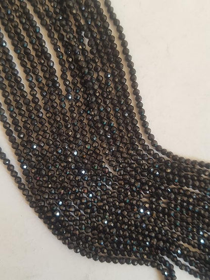Elegant gemstone strands adorned with 2mm beads highlighting the beauty of black spinel.