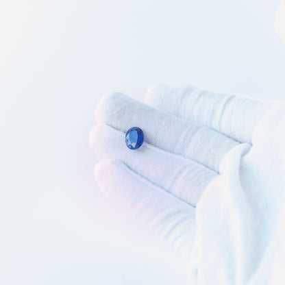 Blue Sapphire faceted oval cabochon with deep blue colour and polished shine, ideal for fine jewellery making.